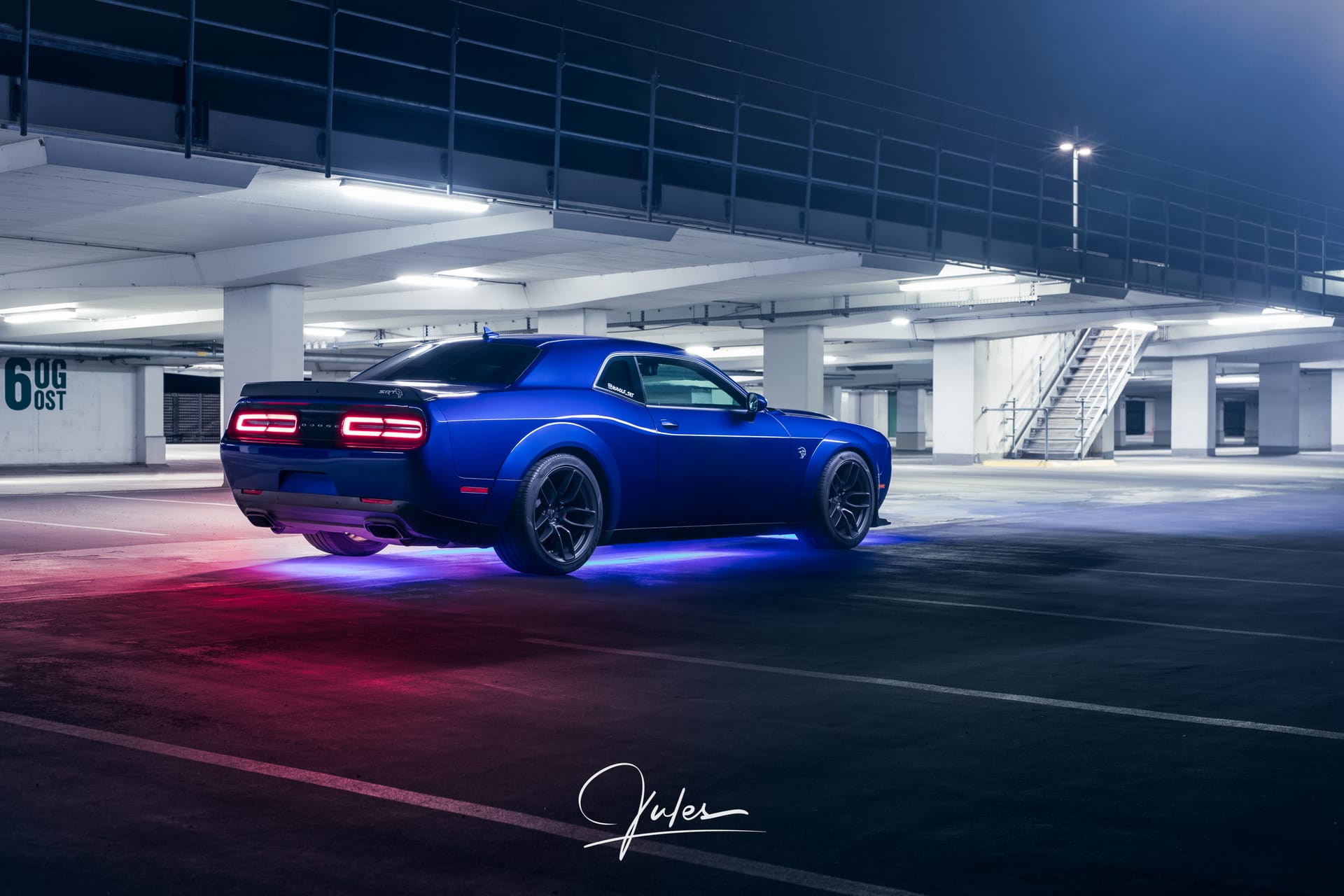 Rear three-quarter view with glowing tail lights